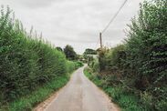 Country road winding through a rural English village