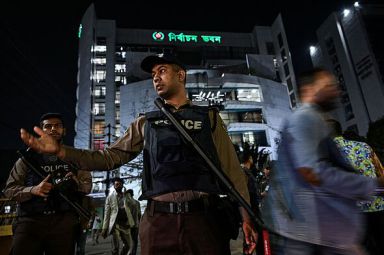 Police officer at night in Bangladesh