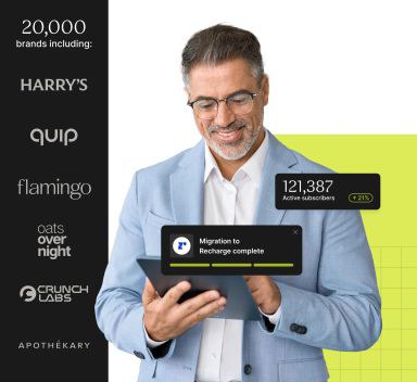 A person wearing glasses smiles while using a tablet that displays active subscriber data.