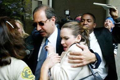 Actress Winona Ryder and her attorney, Mark J. Geragos, arrive at the Beverly Hills Municipal Court for her preliminary hearing on shoplifting charges June 3, 2002 in Beverly Hills, CA