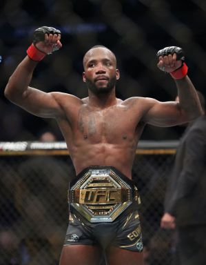 Leon Edwards celebrates victory after the welterweight title bout against Kamaru Usman