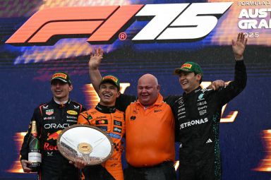 Second-placed Red Bull Racing's Dutch driver Max Verstappen (L), first-placed McLaren's British driver Lando Norris (2L) and third-placed Mercedes' British driver George Russell (R) celebrate on the podium after the Australian Formula One Grand Prix at Albert Park Circuit in Melbourne on March 16, 2025. (Photo by Saeed KHAN / AFP via Getty Images) / -- IMAGE RESTRICTED TO EDITORIAL USE - STRICTLY NO COMMERCIAL USE --
