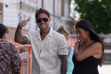 Stephen Bear give a thumbs up outside of Thames Magistrates' Court