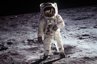 Astronaut Buzz Aldrin walks on the surface of the moon 