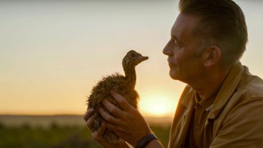 Chris Packham holding a chick