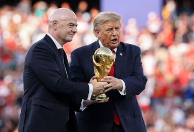 U.S. President Donald Trump and FIFA President Gianni Infantino hold the FIFA World Cup Winner's Trophy 