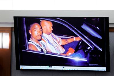 A 1996 photo of rapper Tupac Shukur (L) and Marion "Suge" Knight is  displayed during the Duane Davis murder trial